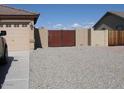 The property features a private gate to access the home with extra space for parking at 32071 N Chestnut Trl, San Tan Valley, AZ 85143