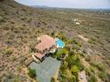 Estate-style home with a tennis court and large pool surrounded by desert landscaping at 36879 N 38Th St, Cave Creek, AZ 85331