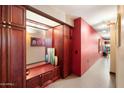 Hallway has a sitting bench, storage cabinets, and decorative elements at 4808 N 24Th St # 1424, Phoenix, AZ 85016