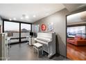 Bright living space with a white piano, modern decor, and expansive windows with mountain views at 4808 N 24Th St # 1424, Phoenix, AZ 85016