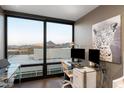 Bright office space with a glass desk and expansive windows that boast amazing city and mountain views at 4808 N 24Th St # 1424, Phoenix, AZ 85016