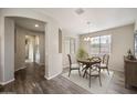 Elegant dining area with stylish chandelier, neutral tones, and wood-look flooring at 5628 S Winchester --, Mesa, AZ 85212