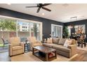 Bright living room with access to the backyard, featuring comfortable seating and stylish decor at 6858 E Orion Dr, Scottsdale, AZ 85257
