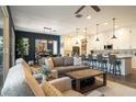 Spacious living area featuring a large kitchen island with bar seating and comfortable seating arrangements at 6858 E Orion Dr, Scottsdale, AZ 85257