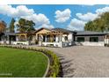 Beautiful single-story home with manicured landscaping, a circular driveway, and a covered front porch at 7014 E Palo Verde Ln, Paradise Valley, AZ 85253