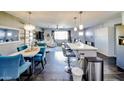 Open concept living space with modern furnishings, a dining area, and a view of the backyard at 1207 E Alice Ave, Phoenix, AZ 85020