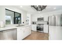 Spacious kitchen with white cabinets, stainless steel appliances, and quartz countertops at 17414 N 56Th Way, Scottsdale, AZ 85254