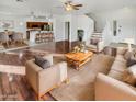 Open concept living room showcases wood floors and lots of natural light at 17649 W Young St, Surprise, AZ 85388