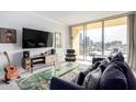 Bright living room with a comfortable sofa and city views at 207 W Clarendon Ave # 5H, Phoenix, AZ 85013