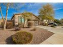 Attractive single-story residence boasting low maintenance landscaping, a spacious driveway, and an attached two-car garage at 21198 W Berkeley Rd, Buckeye, AZ 85396