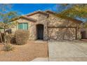 Charming single-Gathering home with a well-manicured lawn, a cozy entrance, and an attached two-car garage at 21198 W Berkeley Rd, Buckeye, AZ 85396