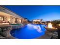 Beautiful pool features fire bowls, rock accents and a spa with an outdoor seating area at 2330 N Channing --, Mesa, AZ 85207