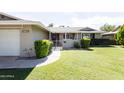Well-maintained home featuring a lush green lawn and welcoming front porch at 3726 S Juniper St, Tempe, AZ 85282