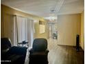 Inviting living room with hardwood floors and natural light; washer and dryer available at 4065 E University Dr # 271, Mesa, AZ 85205