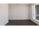 Bright room with fresh white walls and a large window at 743 E Holmes Ave, Mesa, AZ 85204