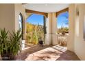 Outdoor patio with tile flooring offering views of desert landscape and mountain backdrop at 9370 E Calle De Las Brisas --, Scottsdale, AZ 85255