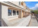 Charming home showcasing stucco facade, a private patio, and a tiled walkway at 10757 N 74Th St # 1016, Scottsdale, AZ 85260