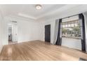 Bright, empty living room featuring hardwood floors, recessed ceiling and large windows at 2218 N Dayton St, Phoenix, AZ 85006