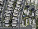 Aerial view of a home with a brick roof in a well-kept neighborhood at 26 S Tiago Dr, Gilbert, AZ 85233
