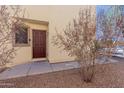 A welcoming front door with desert landscaping and an inviting entrance at 37379 W Amalfi Ave, Maricopa, AZ 85138