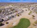 Expansive aerial view of the house backing onto the golf course, lush landscaping, and refreshing pool at 6579 S Classic Way, Gilbert, AZ 85298