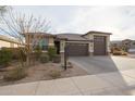 Charming single-Gathering home with a three-car garage and mature landscaping at 7735 W Agora Ln, Phoenix, AZ 85043
