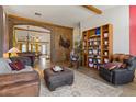 Open floor plan with a stone archway, bright tile flooring, and natural light at 9826 E Irwin Cir, Mesa, AZ 85209
