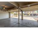 Open three-car garage showcasing the spacious interior, offering plenty of room for vehicles and storage at 10318 E Irwin Ave, Mesa, AZ 85209