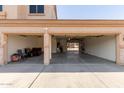 Well-lit three-car garage with ample space, ideal for parking and home projects at 10318 E Irwin Ave, Mesa, AZ 85209