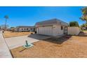 Charming single-story home featuring a two car garage and well maintained lawn at 10419 W Loma Blanca Dr, Sun City, AZ 85351