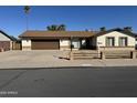 Charming single-story home featuring a two-car garage and a well-maintained front yard at 10633 N 46Th Ave, Glendale, AZ 85304