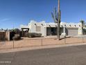 Desert home with Southwestern architecture and desert foliage at 1088 N Desert View Dr, Apache Junction, AZ 85120