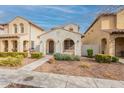 Attractive two-story home with landscaped front yard, inviting walkway, and covered entry at 1088 S Storment Ln, Gilbert, AZ 85296