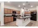 Modern kitchen boasting granite countertops, an island with seating, and stainless steel appliances at 11674 E Yeager Cyn, Gold Canyon, AZ 85118