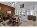 Inviting dining room with a wooden table, chairs, colorful rug, and decorative accents at 2514 E Espada Trl, Casa Grande, AZ 85194