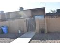 The property is a townhome with desert landscaping and an enclosed front courtyard at 3646 N 67Th Ave # 75, Phoenix, AZ 85033