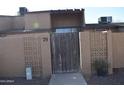 The property is a townhome with desert landscaping and an enclosed front courtyard at 3646 N 67Th Ave # 75, Phoenix, AZ 85033