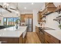 Bright kitchen with a spacious island, stainless steel appliances, and modern cabinetry at 536 E Aurora Dr, San Tan Valley, AZ 85140