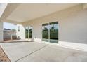 Covered patio with a concrete slab, offering ample space for outdoor relaxation at 909 E Desert Ln, Phoenix, AZ 85042