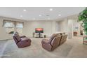 Bright living room featuring carpeted flooring, neutral paint, and comfortable seating at 18298 N Kari Ln, Maricopa, AZ 85139