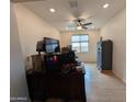 This is a spare room with neutral paint and flooring, featuring a ceiling fan and natural light at 20407 W Calle Encorvada --, Buckeye, AZ 85396