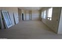 Large bedroom space with a row of windows offering plenty of natural light and French doors at 29022 N 166Th Ave, Surprise, AZ 85387