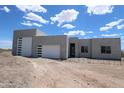 Stunning desert home with a spacious three-car garage and modern architectural details at 29022 N 166Th Ave, Surprise, AZ 85387