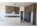 Spacious kitchen with ample cabinet space and a large island under construction at 29022 N 166Th Ave, Surprise, AZ 85387