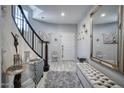 Elegant foyer with curved staircase, decorative mirror, and stylish decor at 3935 E Rough Rider Rd # 1267, Phoenix, AZ 85050