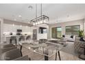 A spacious and stylish living room featuring modern furnishings at 41262 W Almira Dr, Maricopa, AZ 85138