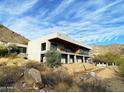 Modern home nestled in Arizona's desert landscape featuring clean lines and panoramic views at 4232 E Upper Ridge Way, Paradise Valley, AZ 85253