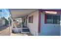 Exterior view of manufactured home featuring covered porch with room for seating at 44 S Hawes Rd # C13, Mesa, AZ 85208