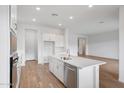 Modern kitchen with white cabinetry, stainless steel appliances, and a center island at 44729 N 44Th Dr, Phoenix, AZ 85087
