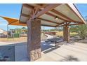 Community picnic tables and playground offer outdoor relaxation and recreation at 44815 N 44Th Dr, Phoenix, AZ 85087